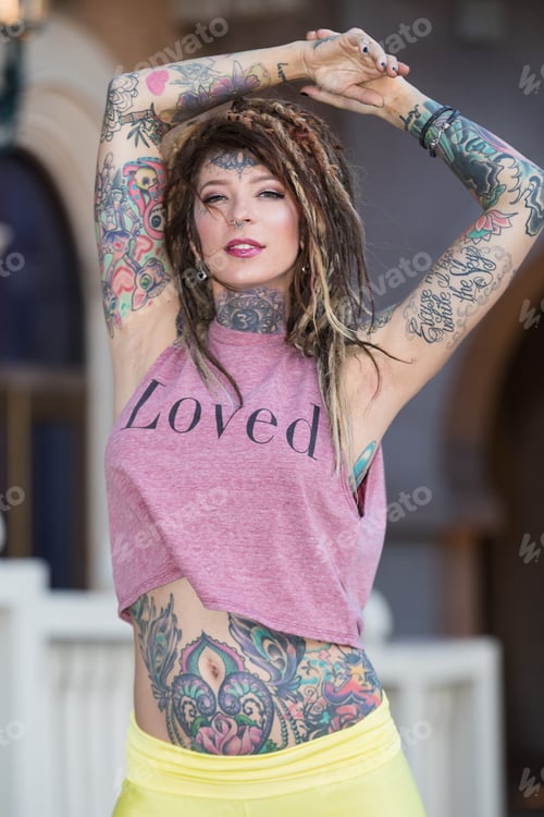 Preview: Beautiful hippie girl with tattoos and dreadlocks