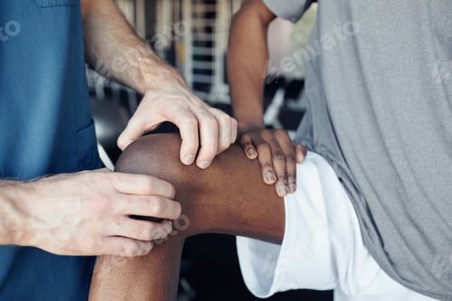 Preview: Physical Therapist Examining Patient's Knee in Clinic