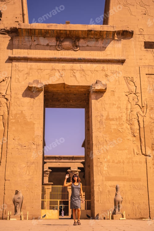 Preview: A Young Tourist Leaving The Edfu Temple Near The Nile River In Aswan. Egypt, Return Of Tourism In