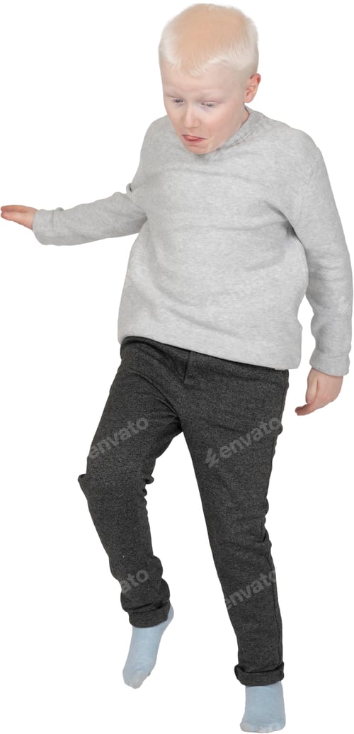 Preview: a young boy in gray pants and a gray sweater