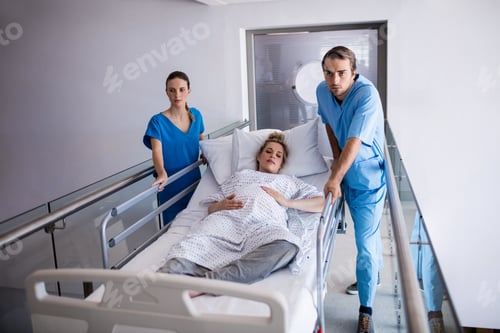 Preview: Team of doctors taking pregnant woman to operation theatre