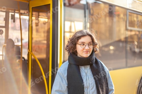 Preview: Public transport. Waiting for the bus. Student girl waiting for transport.
