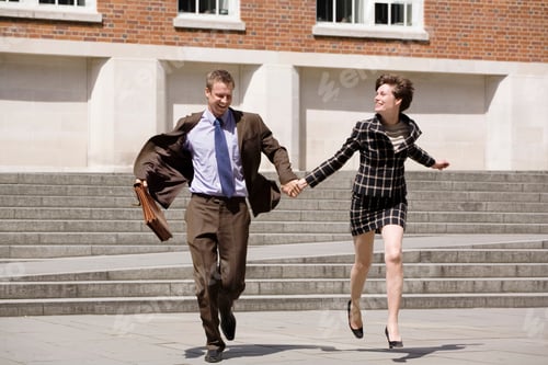Preview: Business people holding hands outdoors