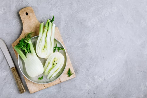 Preview: Fresh raw organic florence fennel bulbs or fennel bulb on gray stone background.