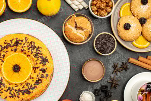 Preview: top view yummy fruity cake with cookies and cup of tea on a dark background biscuit cookie tea sweet