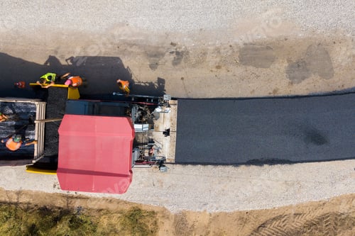 Preview: Aerial view of new road construction with asphalt laying machinery at work