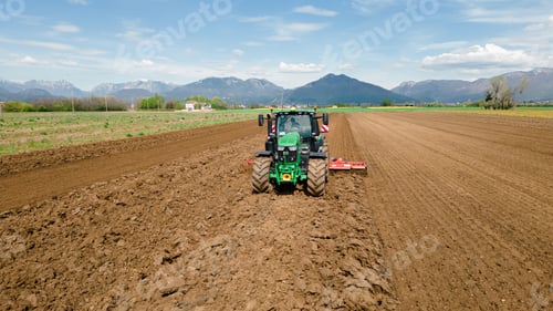 Preview: An image featuring a farmer using modern farming techniques and agricultural innovations to increase