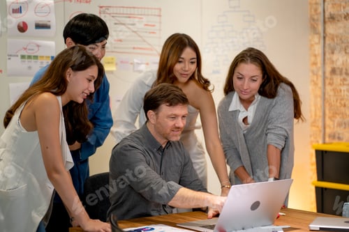 Preview: Professional manger point to monitor of laptop and explain the process of work