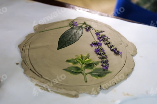 Preview: Creation of stencil ceramics with flowers, leaves of lavender and other plants by pressing on table