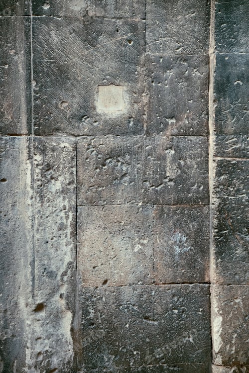 Preview: Wall of old building. Weathered scratched stone blocks.