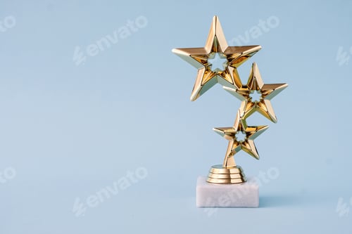 Preview: Three star awards for leader and ranking. Golden shiny prize on a pastel blue background.