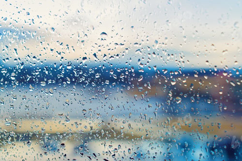 Preview: Wet in rain drops window overlooking the street full frame texture