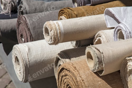 Preview: Rolls of linen canvas textile on market stall