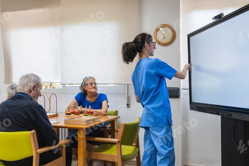 Preview: Caregiver assisting elderly residents in nursing home