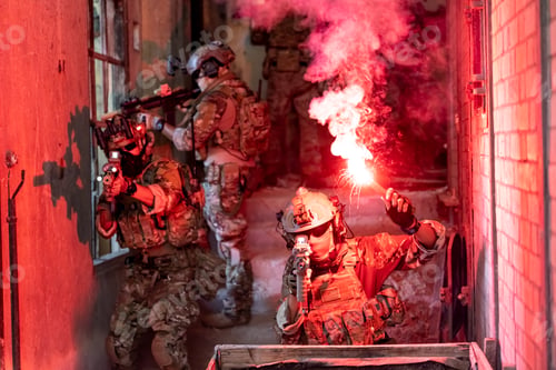 Preview: Soldier in full US MARSOC armed with assault rifle run through the abandoned building. Military