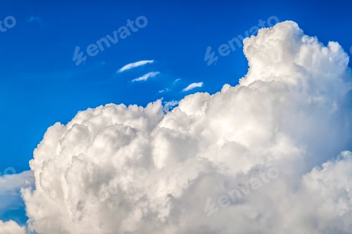 Preview: Puffy white cloud and clear blue sky background