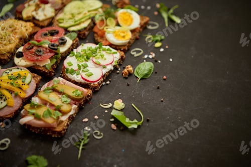 Preview: Top view of different decorated sandwiches as appetizer. Healthy food. Vegetable meal