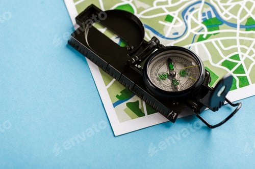 Preview: retro and black compass on map on blue