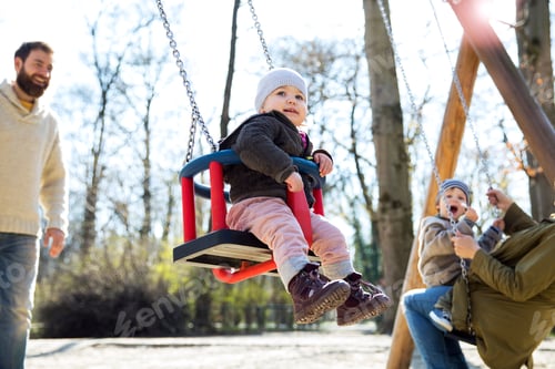 Preview: Happy family on playground