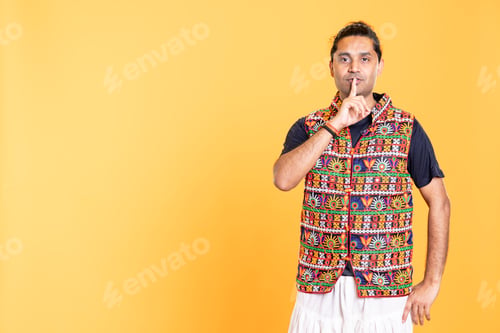 Preview: Person placing finger on lips, doing quiet sign gesture