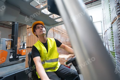 Preview: Warehouse worker operates a forklift