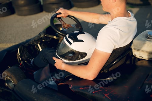 Preview: Handsome man in a karting with a car