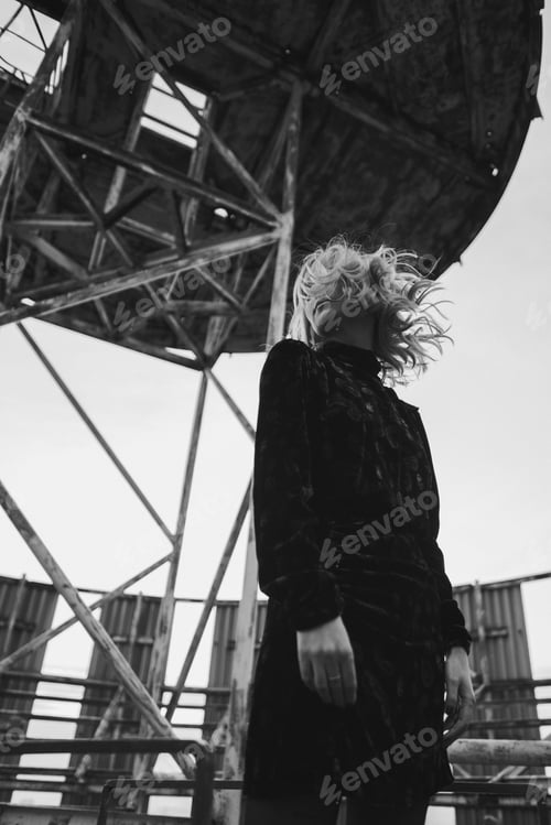 Preview: Romantic and beautiful caucasian woman in stylish clothes on the rooftop outdoor portrait.