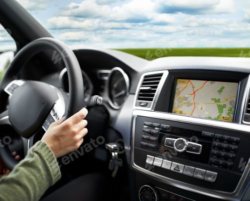 Preview: Cropped shot of a person traveling by car using the on-board GPS to navigate