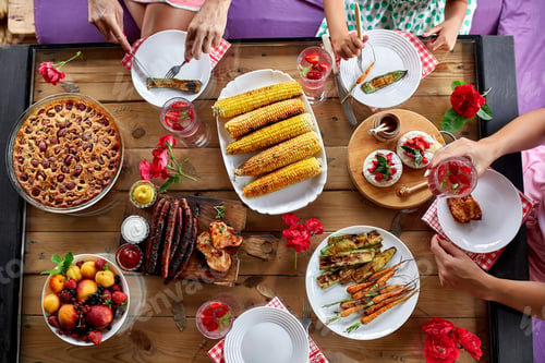 Preview: Top view over a dining table, decorated with flowers, family dinner.