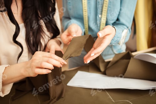 Preview: Seamstresses sew fabric by hand, sweep away details of future outfit. Work process, crafting