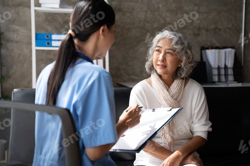 Preview: Asian young nurse supporting elderly patient disabled woman in hospital. Elderly patient care concep