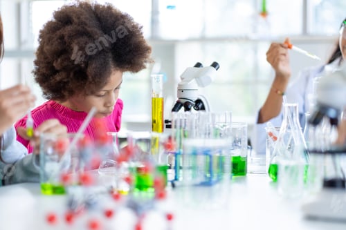 Preview: Group of boys and girls who love science Having fun doing experiments in the school lab.
