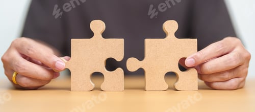 Preview: Hand connecting couple puzzle piece.