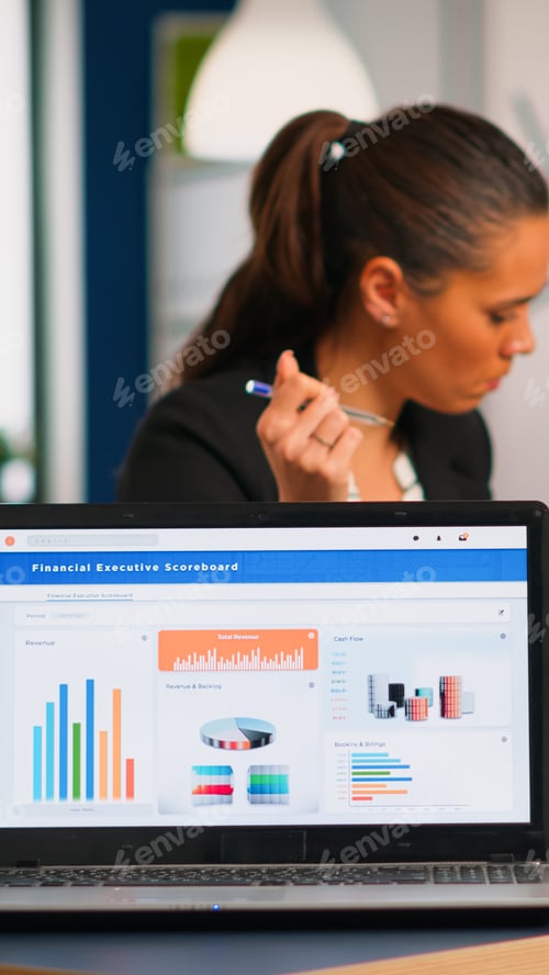 Preview: Business woman talking about financial project using laptop