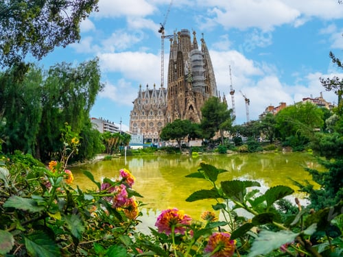 Preview: Basilica of the Sagrada Familia in Barcelona by the lake on a spring morning, Spain