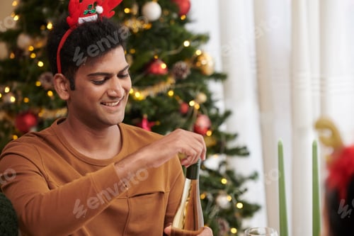 Preview: Man Opening Bottle of Champagne