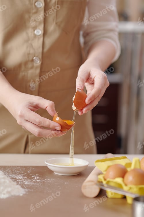 Preview: Woman Separating Egg Yolk from White