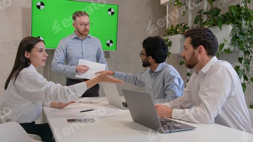 Preview: Male leader speaker coach talking to team multiracial men listen to CEO businessman teaching