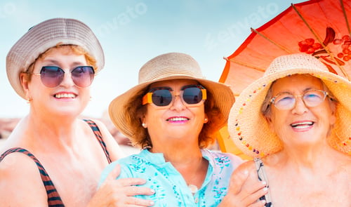 Preview: Portrait of group of friends old age senior women smiling at the camera during summer holiday