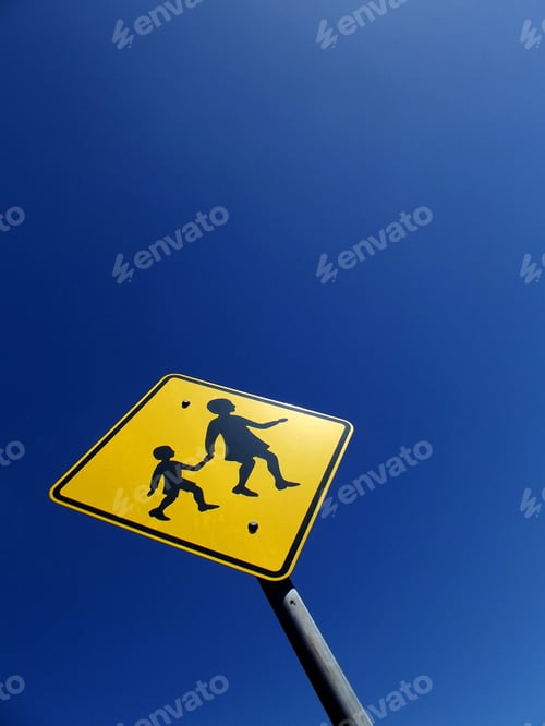 Preview: Children crossing near a school safety sign