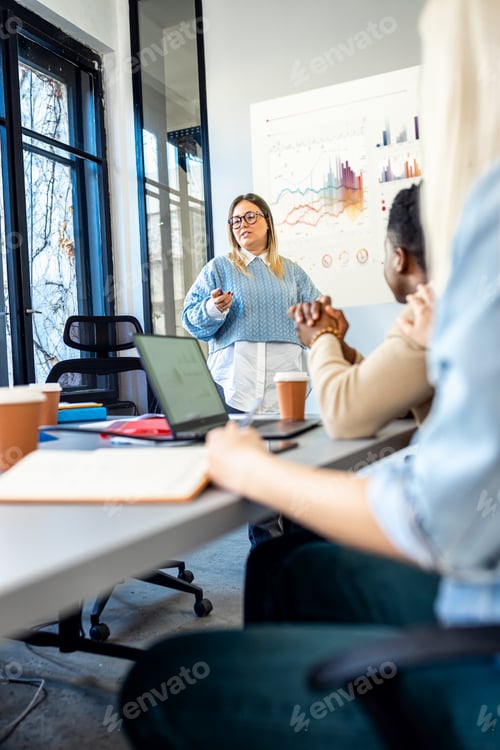 Preview: Diverse group of young business people working on new project together in office.