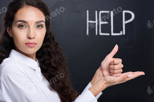 Preview: attractive brunette woman gesturing signed language, with help word on blackboard