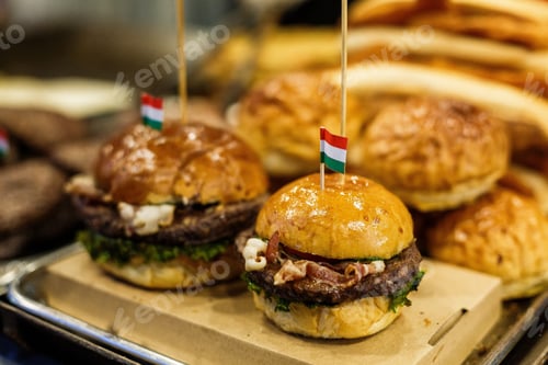 Preview: Grilled meats on a stand at christmas fair in Budapest. Christmas market in Budapest. Hamburger