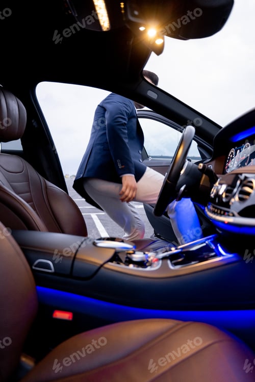 Preview: Businessman get in luxury car, view from vehicle interior