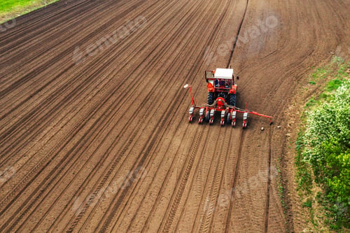 Preview: Aerial view of tractor with mounted seeder performing direct see