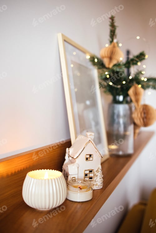Preview: Cozy interior scene featuring decorative candle, miniature house