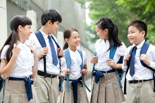 Preview: Lovely schoolchildren in uniform on the way to school