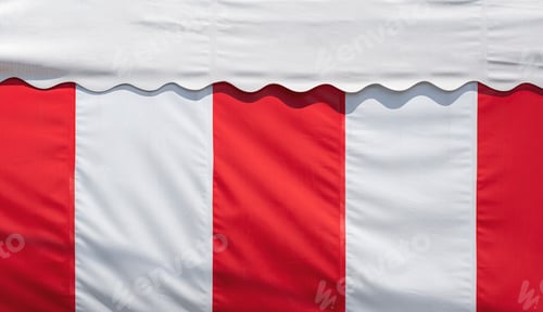 Preview: Background of red and white striped canvas awning and white roof tent with sunlight on surface