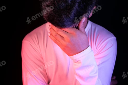 Preview: Close up of sad man covering face with hand.
