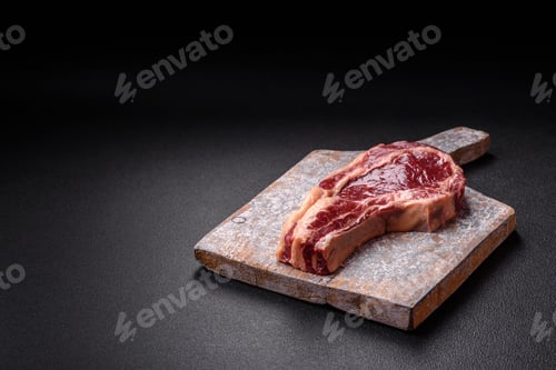 Preview: Fresh, raw beef steak with salt, spices and herbs